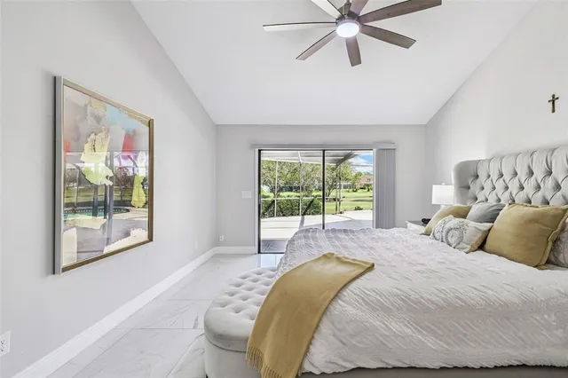 a living room with a bed furniture and a window