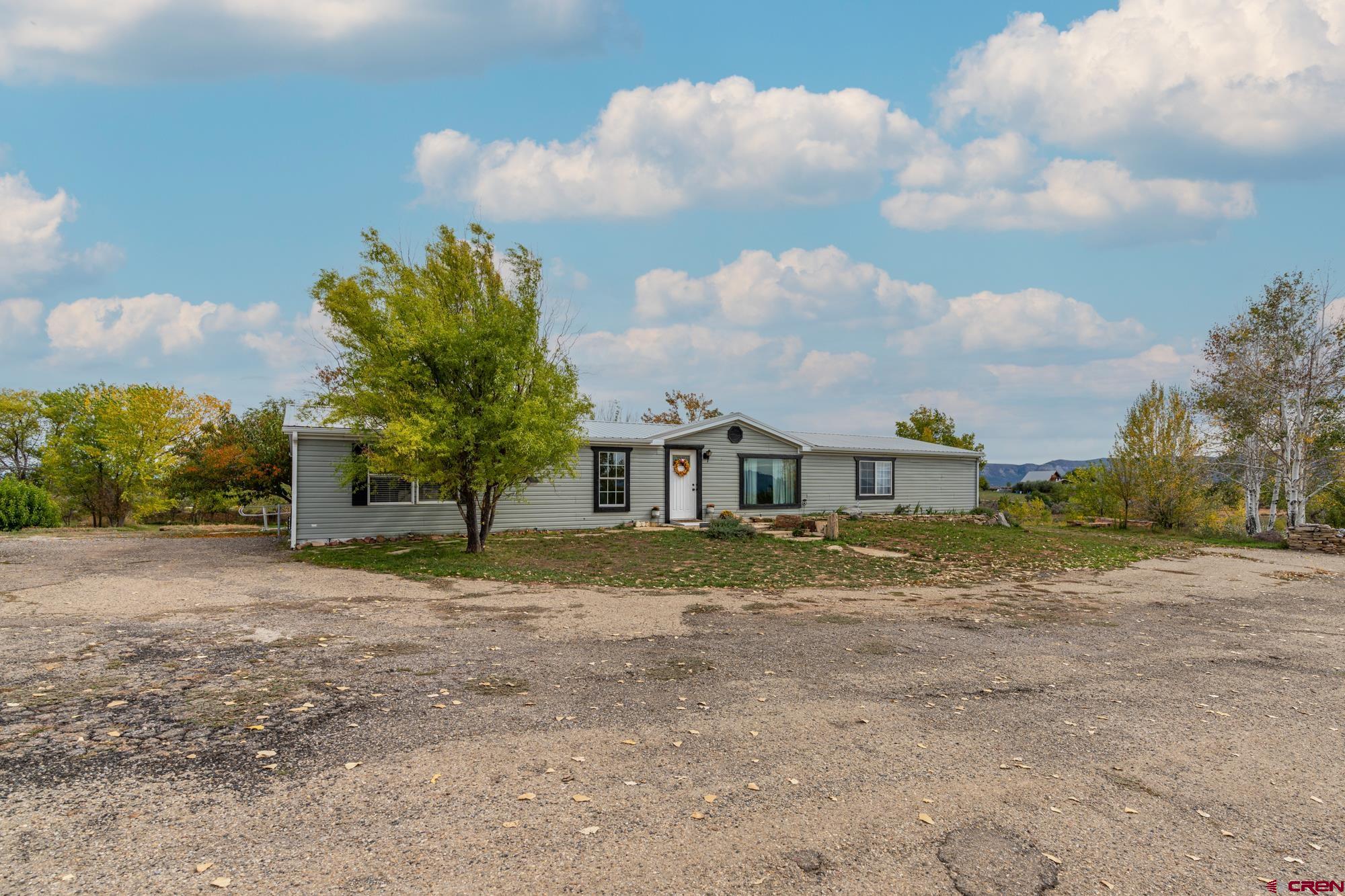 25109 Rd L.4 Cortez, CO 81321 - Photo 1 of 33 a view of a house with a dry yard