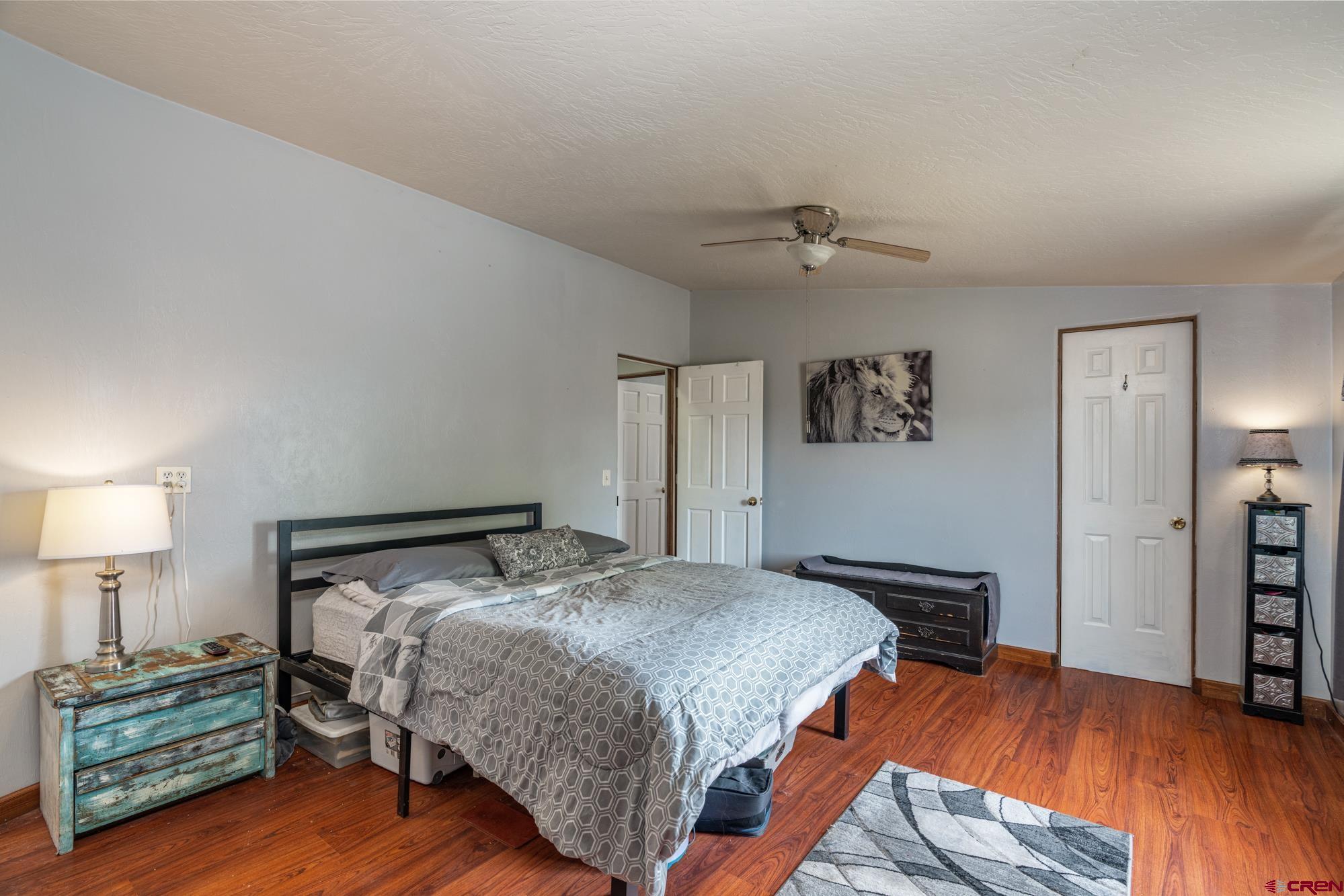 25109 Rd L.4 Cortez, CO 81321 - Photo 16 of 33 a bedroom with a bed and a lamp
