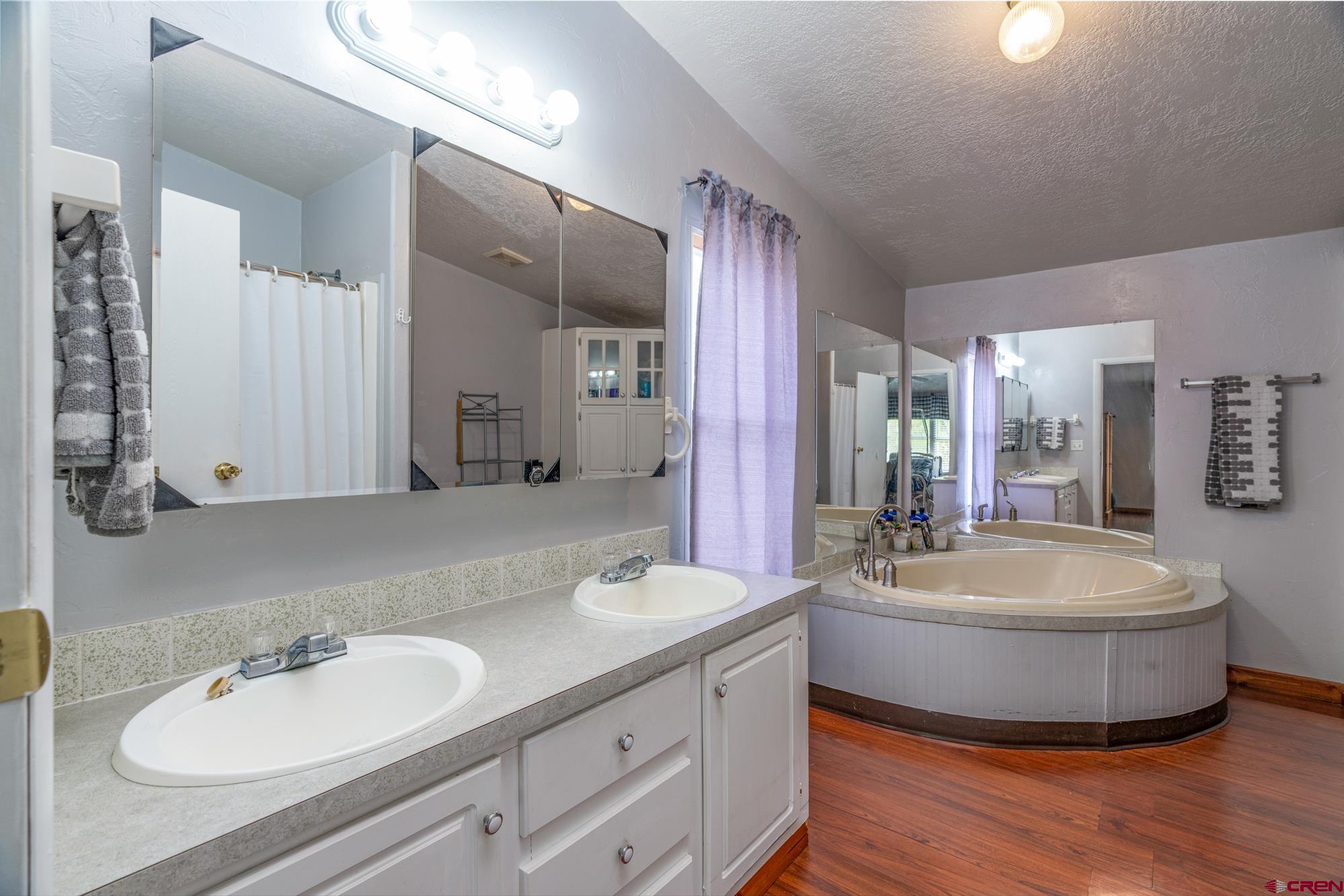 25109 Rd L.4 Cortez, CO 81321 - Photo 17 of 33 a bathroom with a double vanity sink mirror and double