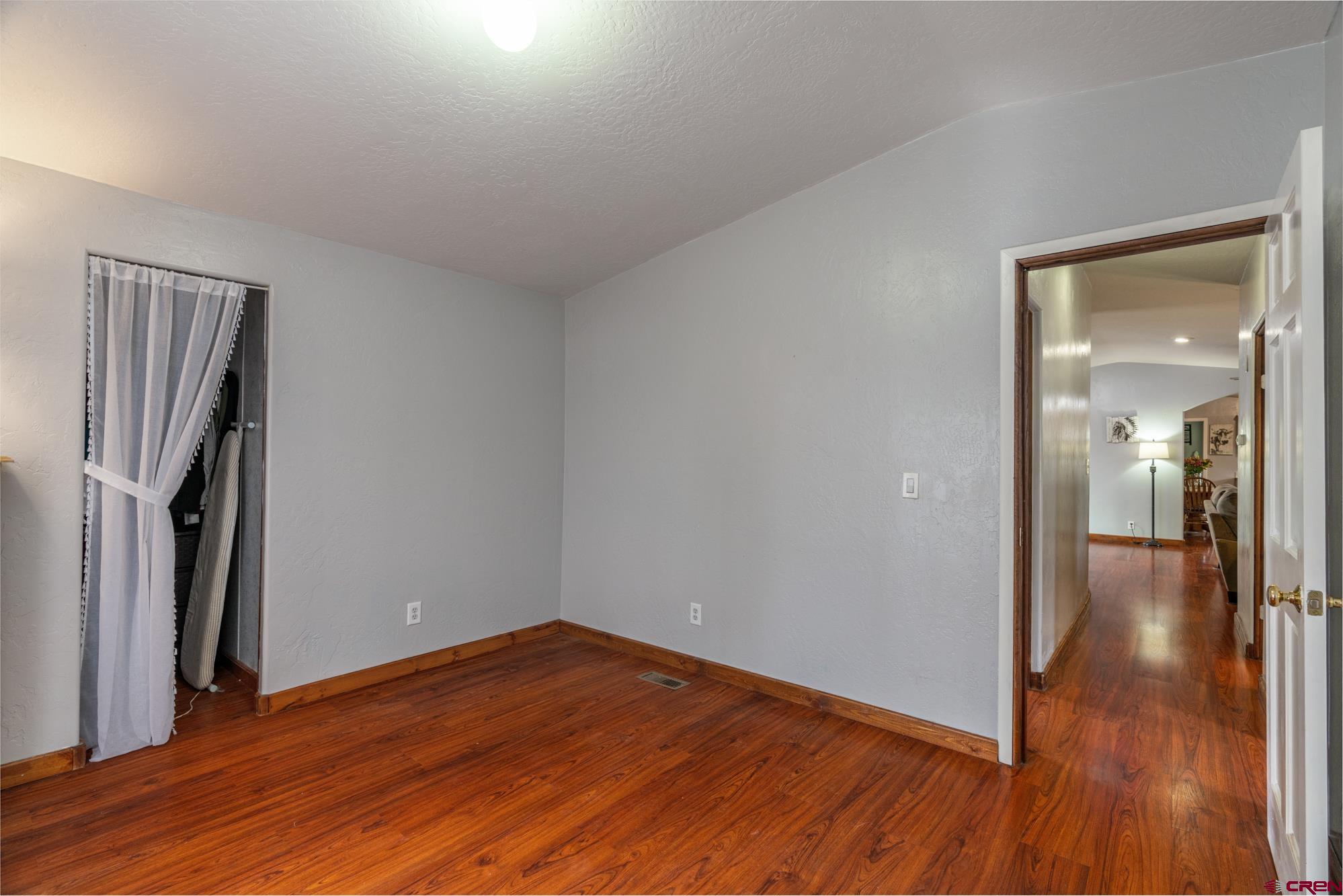 25109 Rd L.4 Cortez, CO 81321 - Photo 20 of 33 a view of a hallway with wooden floor