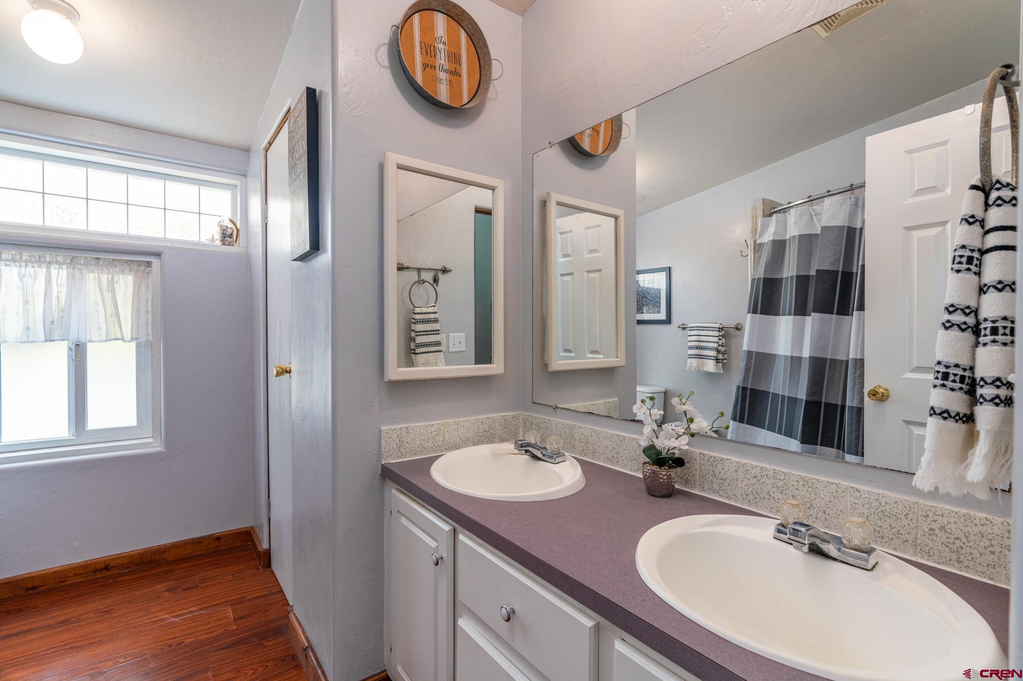 25109 Rd L.4 Cortez, CO 81321 - Photo 21 of 33 a bathroom with a sink double vanity and a mirror