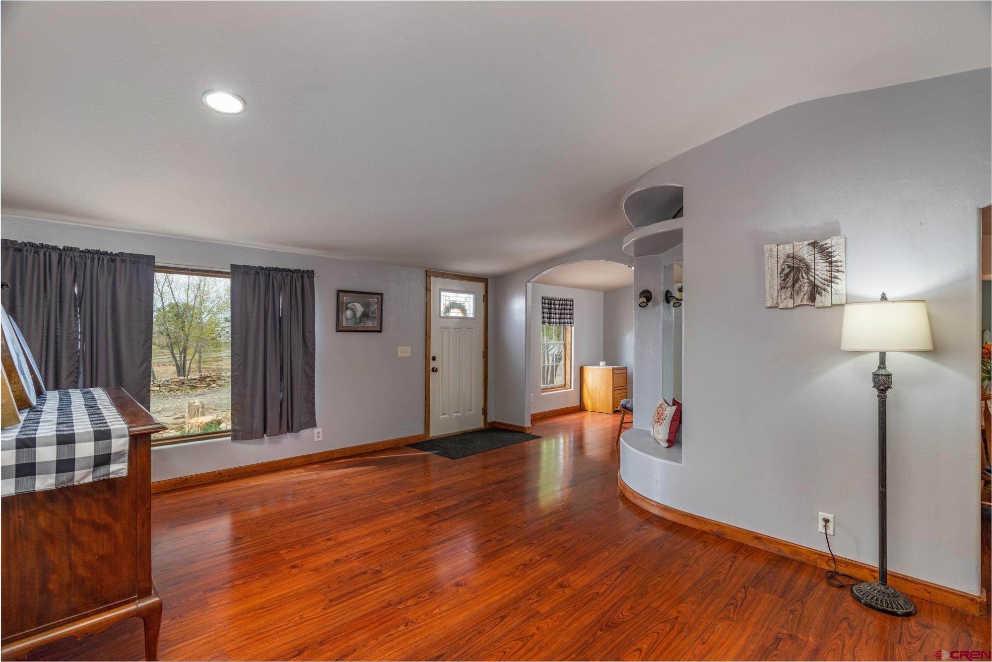 25109 Rd L.4 Cortez, CO 81321 - Photo 8 of 33 wooden floor in an empty room with a window