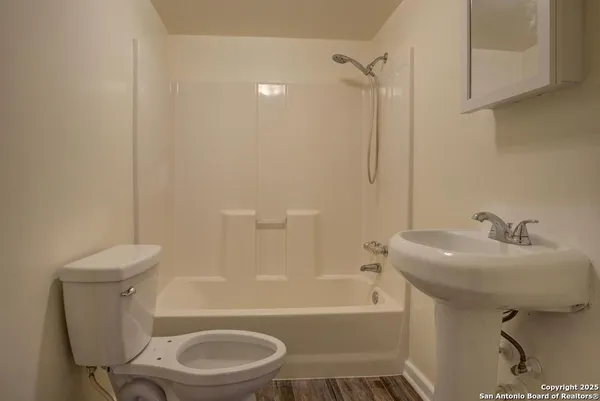 a bathroom with a sink toilet and bathtub
