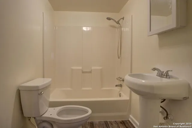 a bathroom with a sink toilet and bathtub