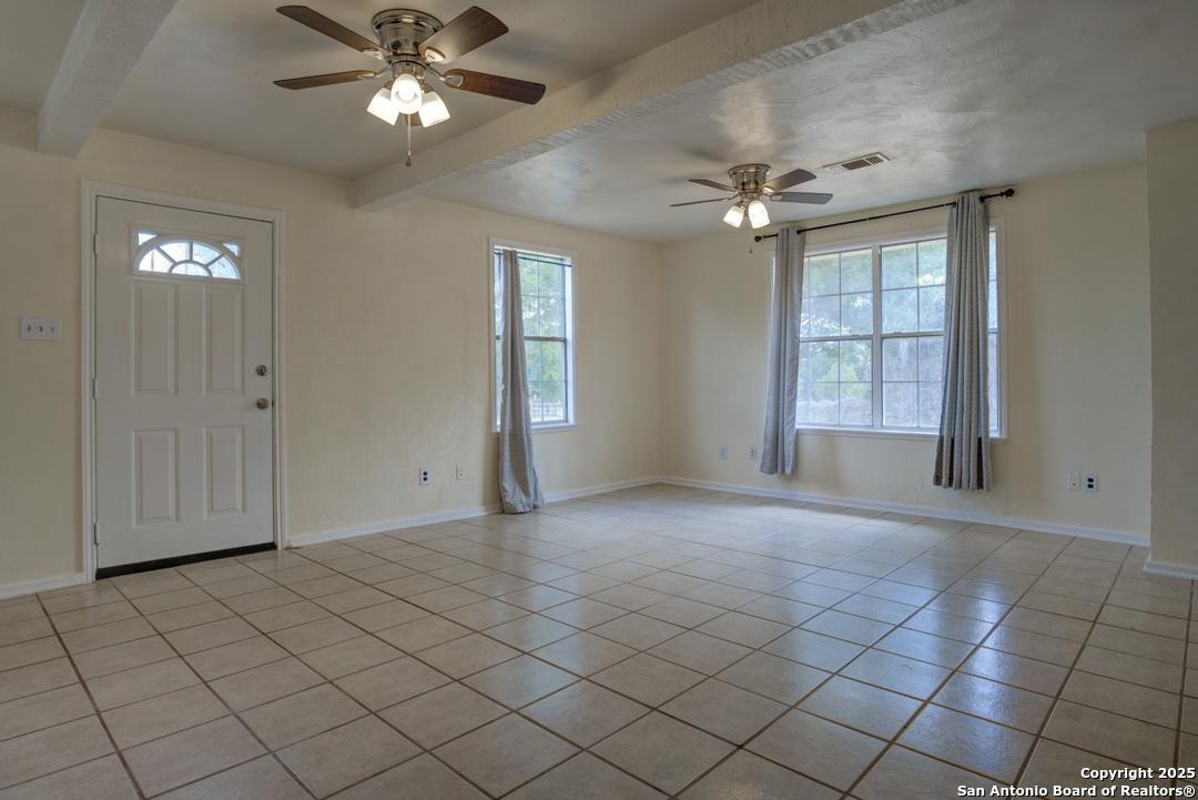 1176 Old Adams Lane Pleasanton, TX 78064 - Photo 14 of 42 a view of an empty room with a window