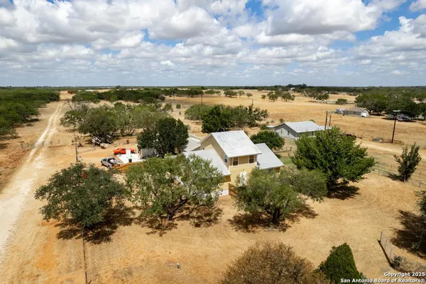 a view of a garden with lawn chairs