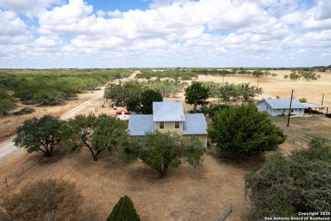 1176 Old Adams Lane Pleasanton, TX 78064 - Photo 31 of 42 a view of a lake with houses in the back