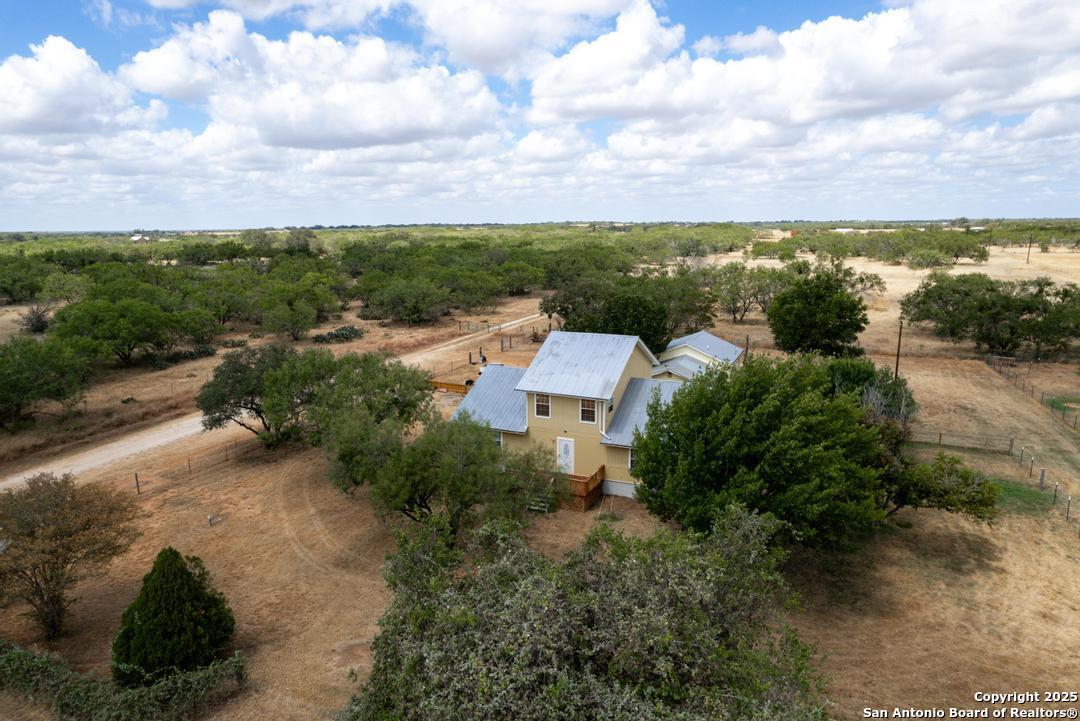 1176 Old Adams Lane Pleasanton, TX 78064 - Photo 32 of 42 a view of a garden with lawn chairs