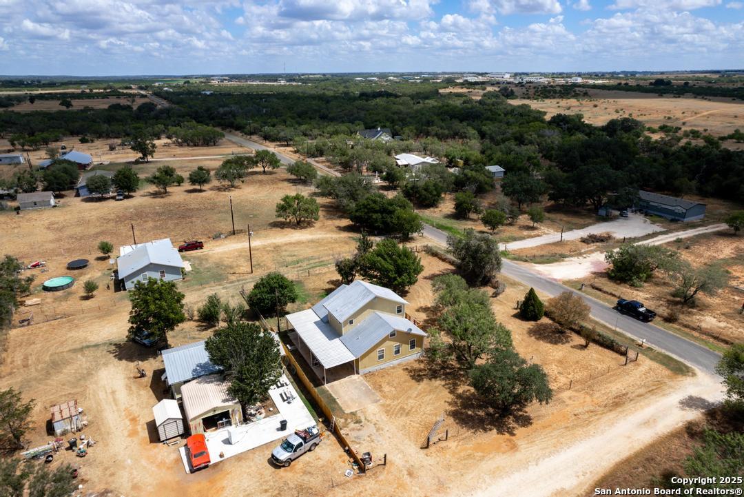 1176 Old Adams Lane Pleasanton, TX 78064 - Photo 39 of 42 an aerial view of residential houses with outdoor space