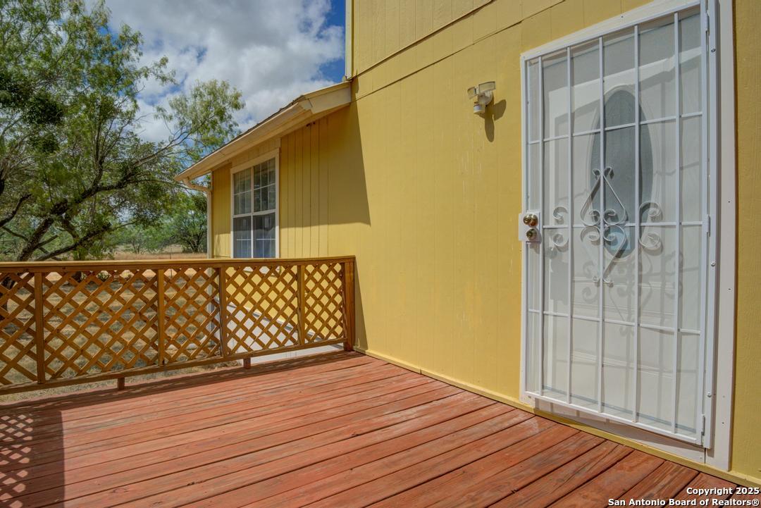 1176 Old Adams Lane Pleasanton, TX 78064 - Photo 4 of 42 a view of a wooden door