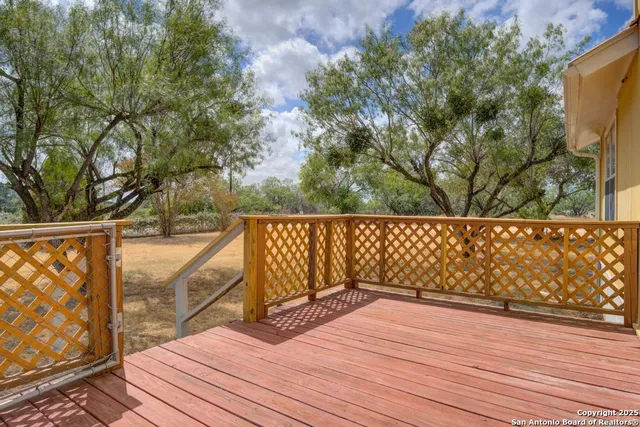 a balcony with wooden floor