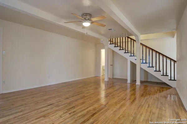 a view of an entryway with wooden floor
