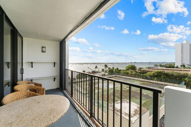a view of a balcony with furniture