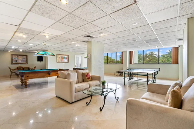 a view of a livingroom with furniture and entryway