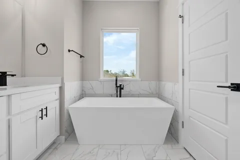 a bathroom with a shower and a sink