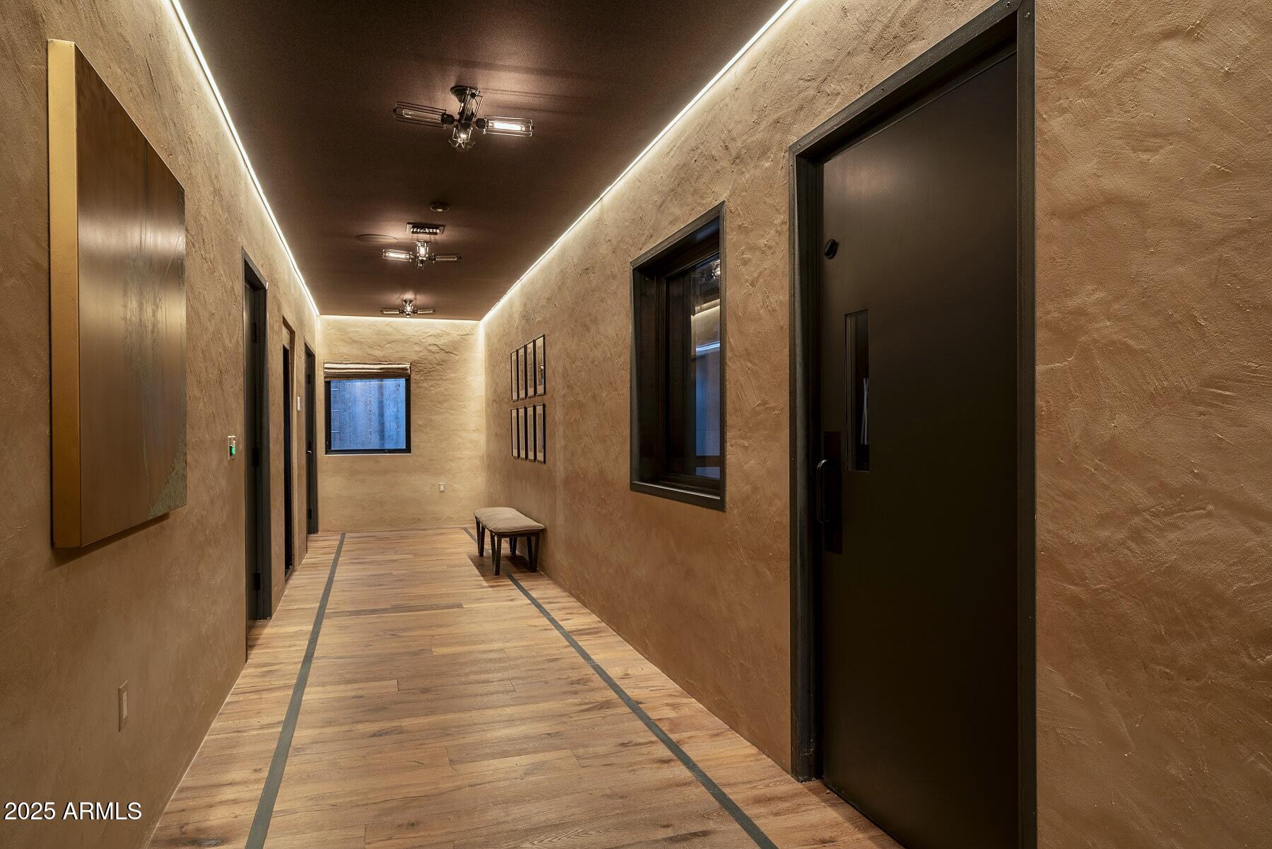 21423 South 147th Street Gilbert, AZ 85298 - Photo 129 of 169 a hallway with wooden floor windows and entryway