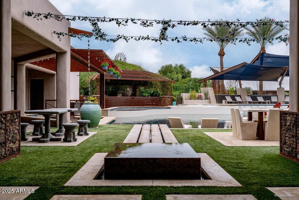 21423 South 147th Street Gilbert, AZ 85298 - Photo 154 of 169 a front view of a house with garden and patio