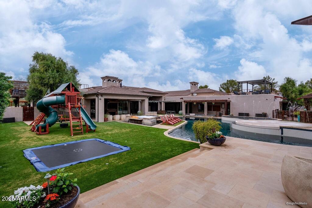 21423 South 147th Street Gilbert, AZ 85298 - Photo 156 of 169 a front view of a house with garden and trees