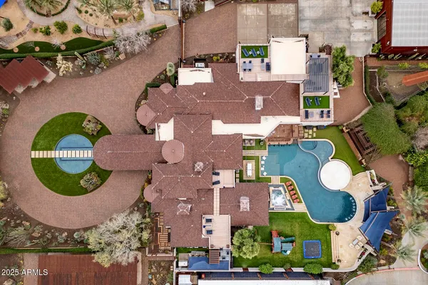 a view of house with swimming pool and furniture