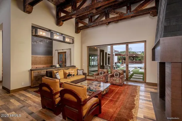 a outdoor living space with furniture and a fireplace