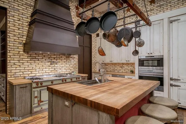 a utility room with sink dryer and washer