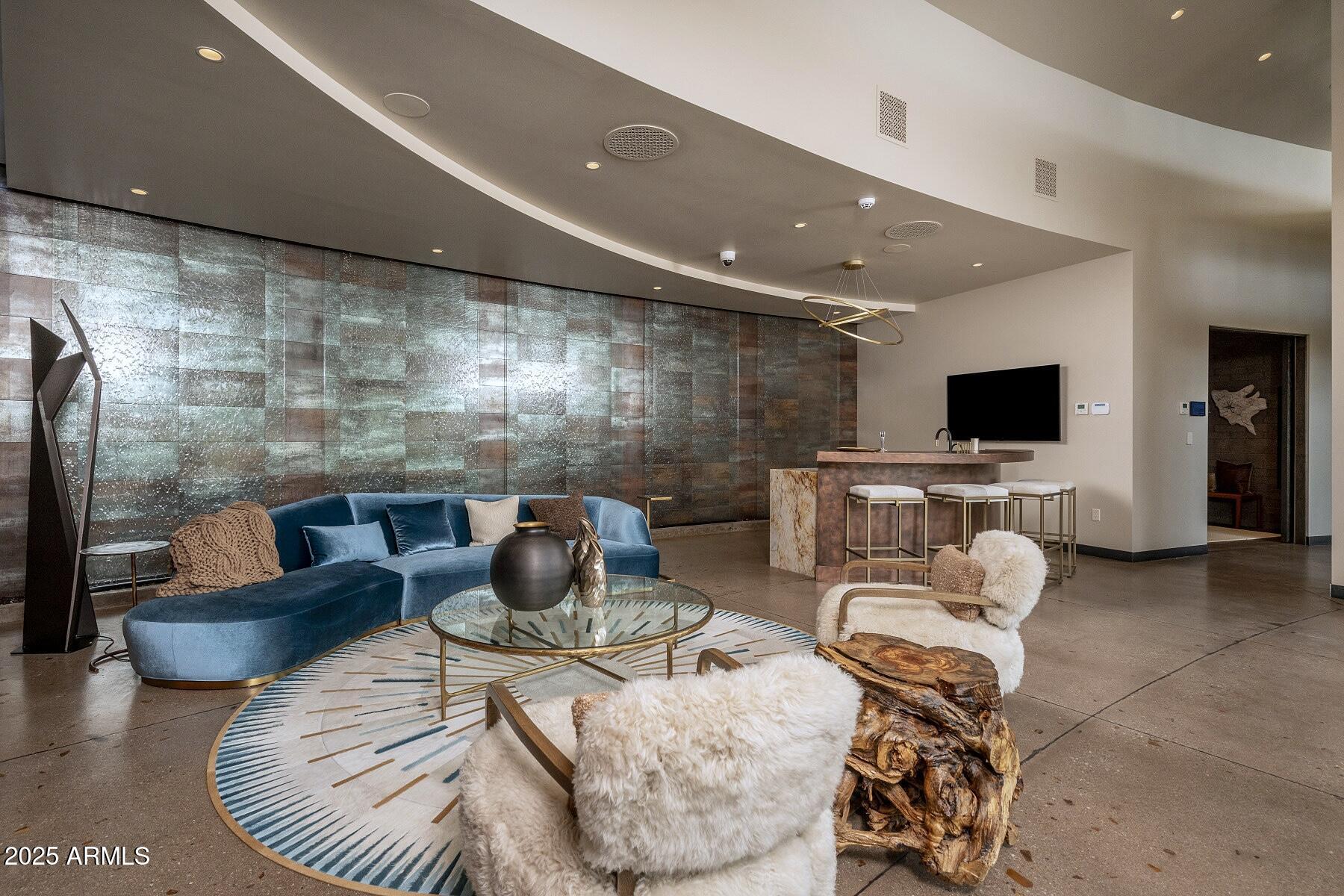 21423 South 147th Street Gilbert, AZ 85298 - Photo 73 of 169 a living room with furniture and a flat screen tv