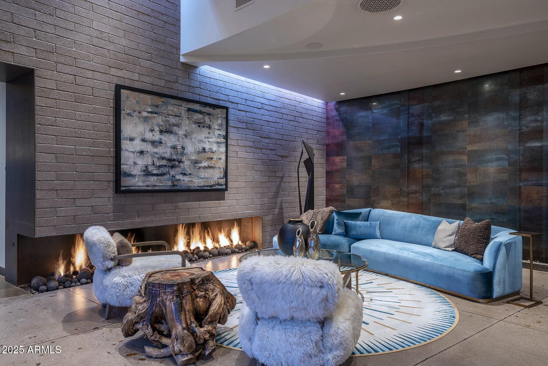 21423 South 147th Street Gilbert, AZ 85298 - Photo 93 of 169 a living room with furniture and a fireplace
