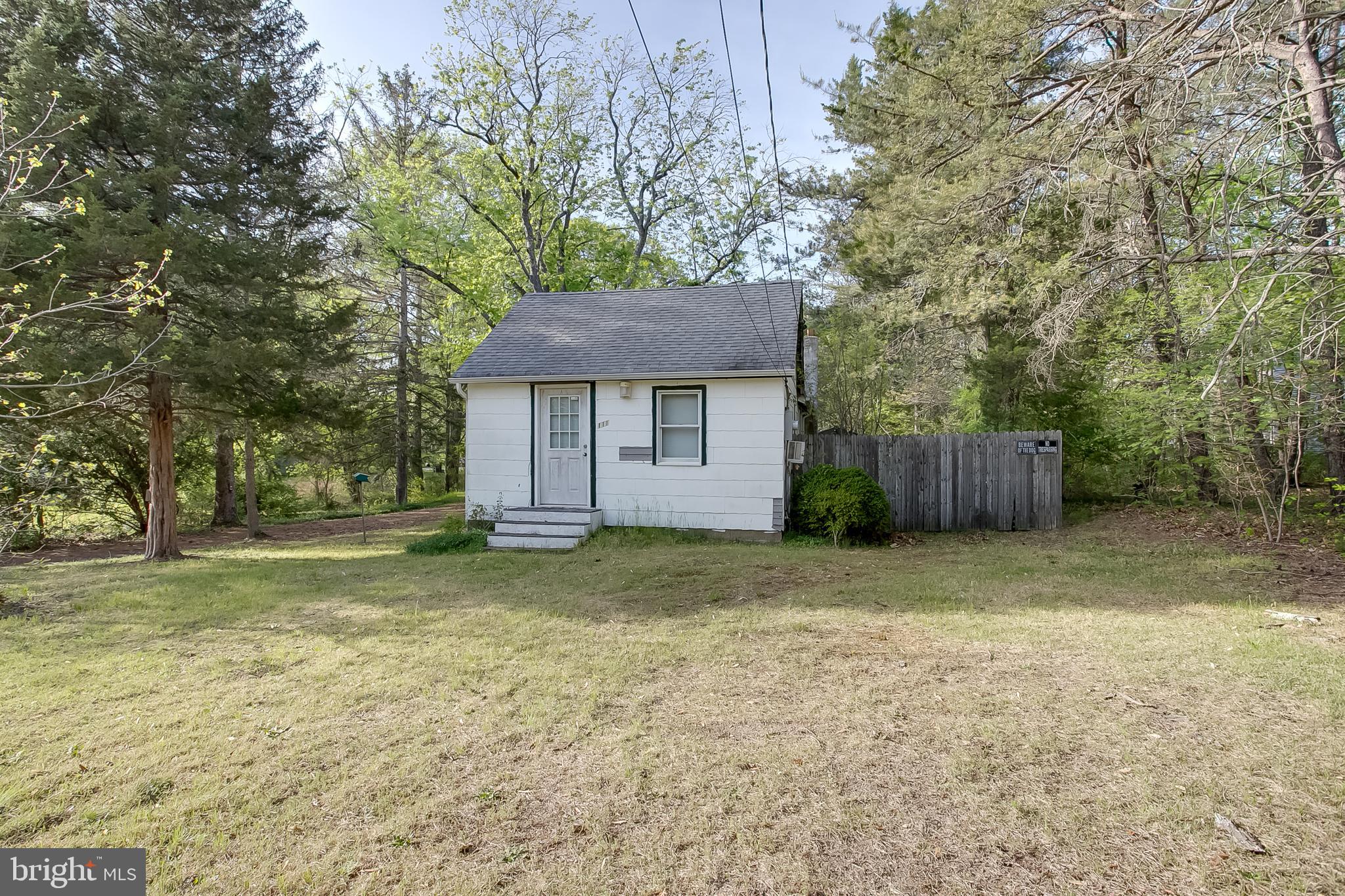 a house with trees in the background