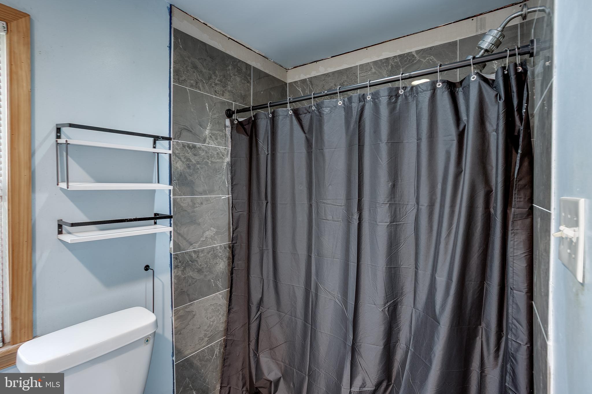 111 Carson Road Southampton, NJ 08088 - Photo 11 of 14 a bathroom with a shower and a toilet