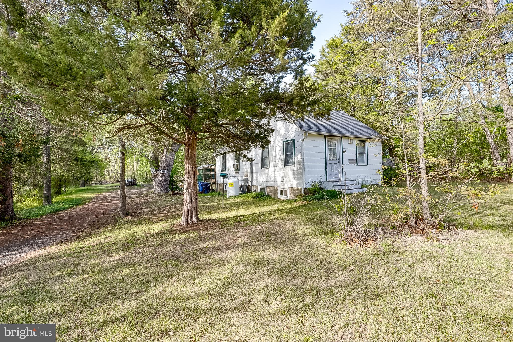 111 Carson Road Southampton, NJ 08088 - Photo 2 of 14 a house with trees in front of it