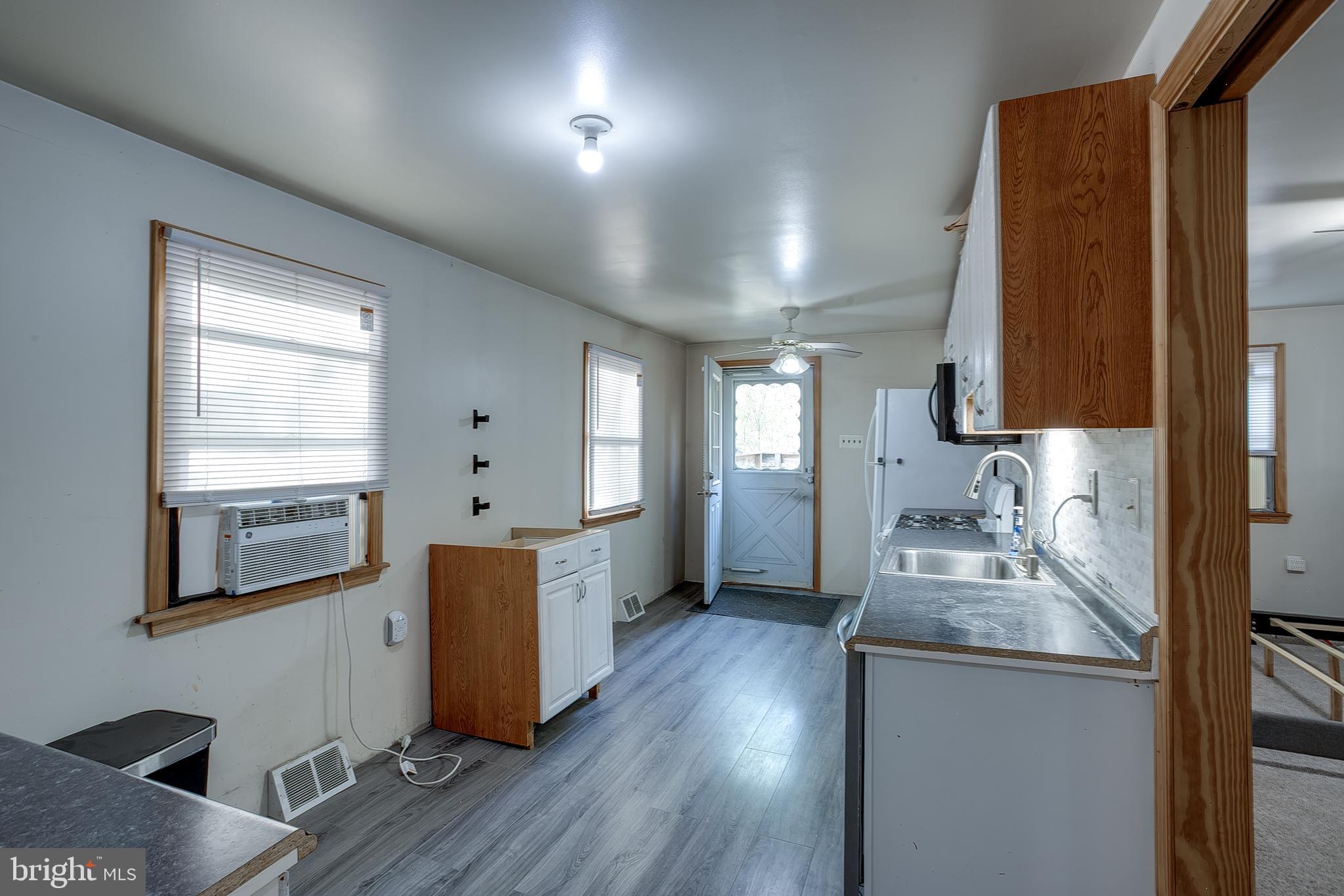 111 Carson Road Southampton, NJ 08088 - Photo 7 of 14 a kitchen with sink refrigerator and window