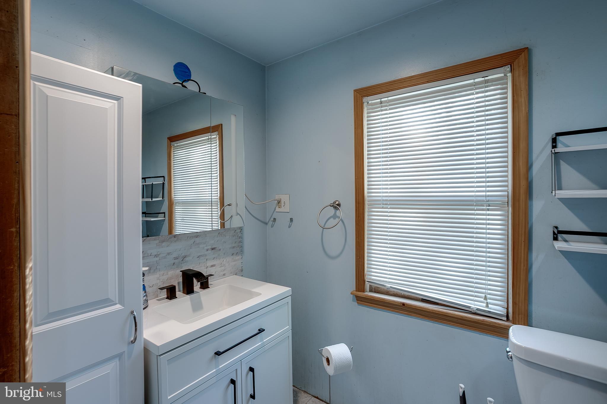 111 Carson Road Southampton, NJ 08088 - Photo 10 of 14 a bathroom with a sink and a mirror