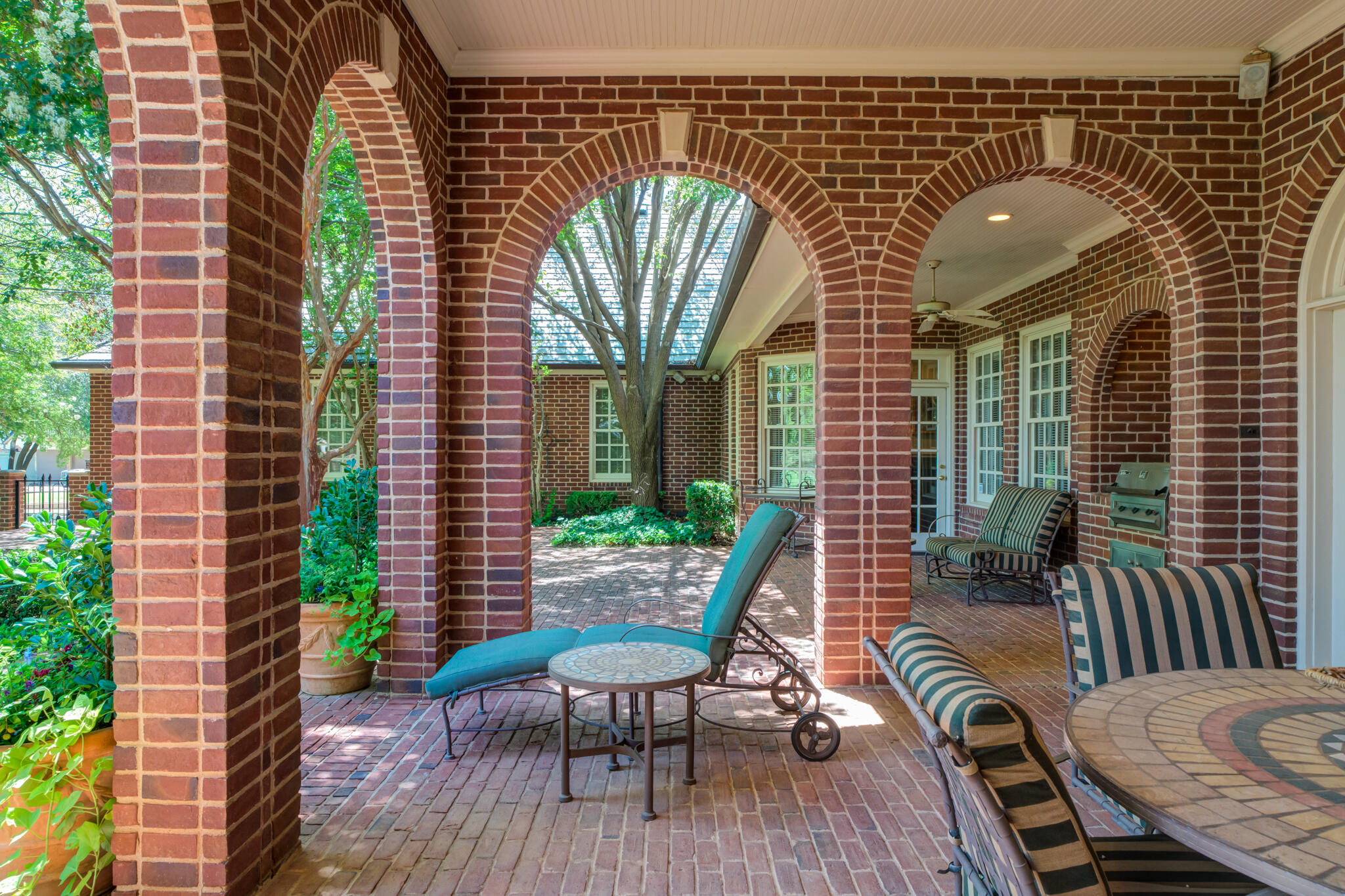 9108 Salem Drive Lubbock, TX 79424 - Photo 13 of 110 a view of a balcony with chairs and a potted plant