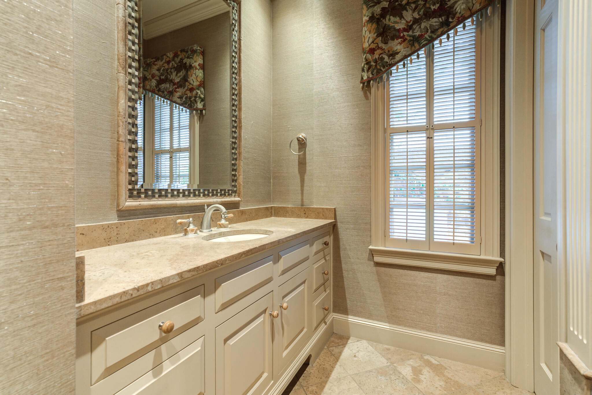 9108 Salem Drive Lubbock, TX 79424 - Photo 66 of 110 a bathroom with a sink a vanity and a mirror