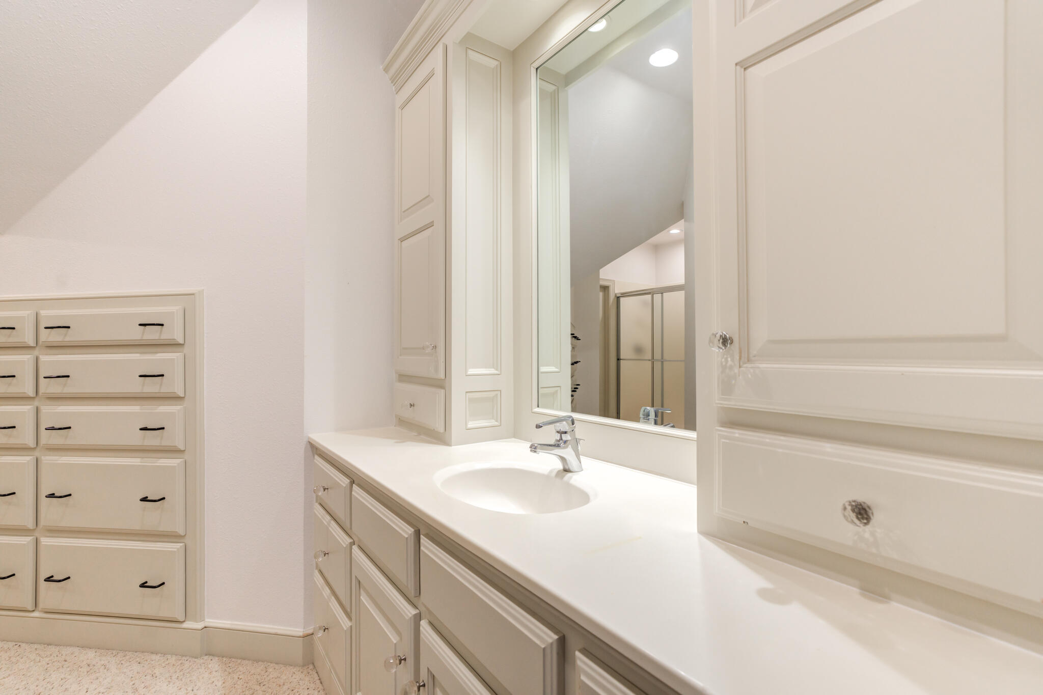 9108 Salem Drive Lubbock, TX 79424 - Photo 99 of 110 a bathroom with a sink and a mirror with bathtub