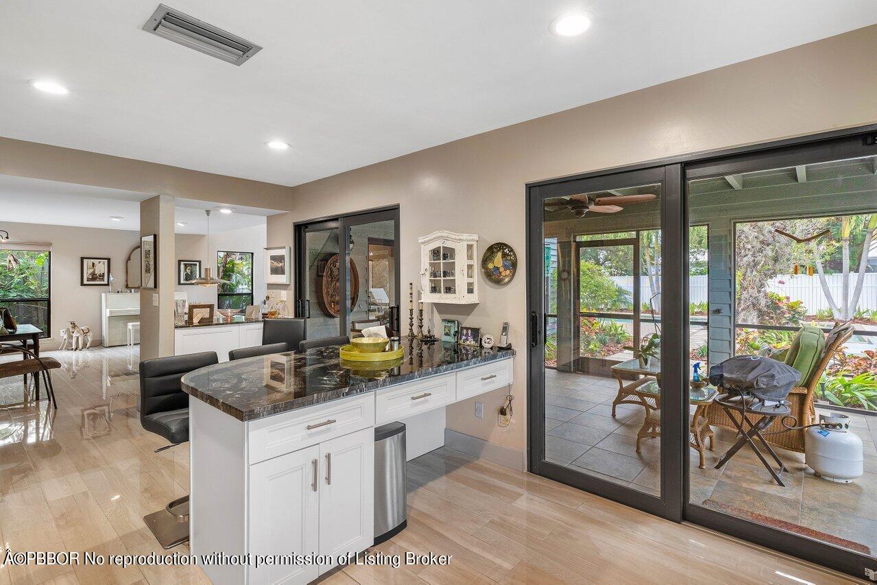 1111 Southwest 19th Street Boca Raton, FL 33486 - Photo 12 of 37 a kitchen with counter top space and furniture