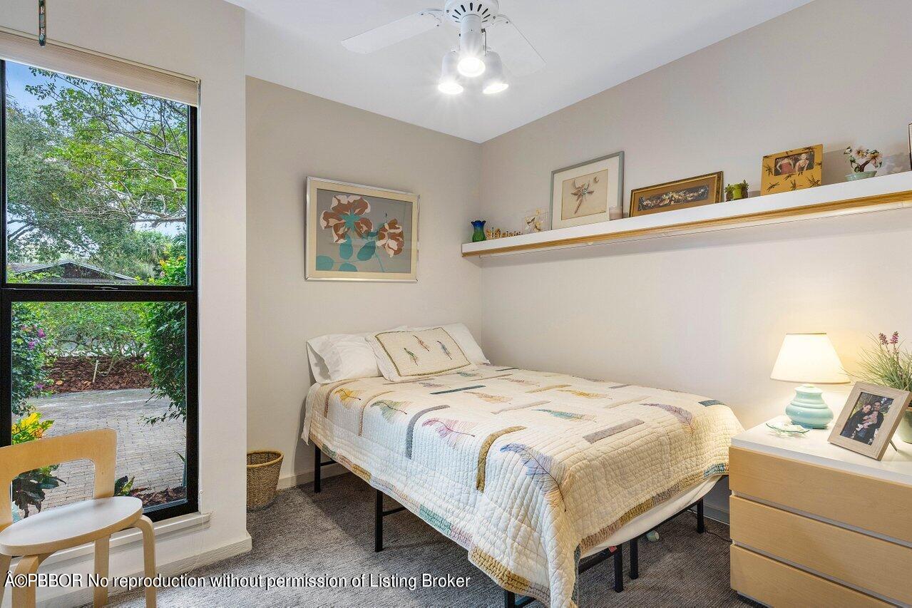 1111 Southwest 19th Street Boca Raton, FL 33486 - Photo 16 of 37 a bedroom with a bed and large window