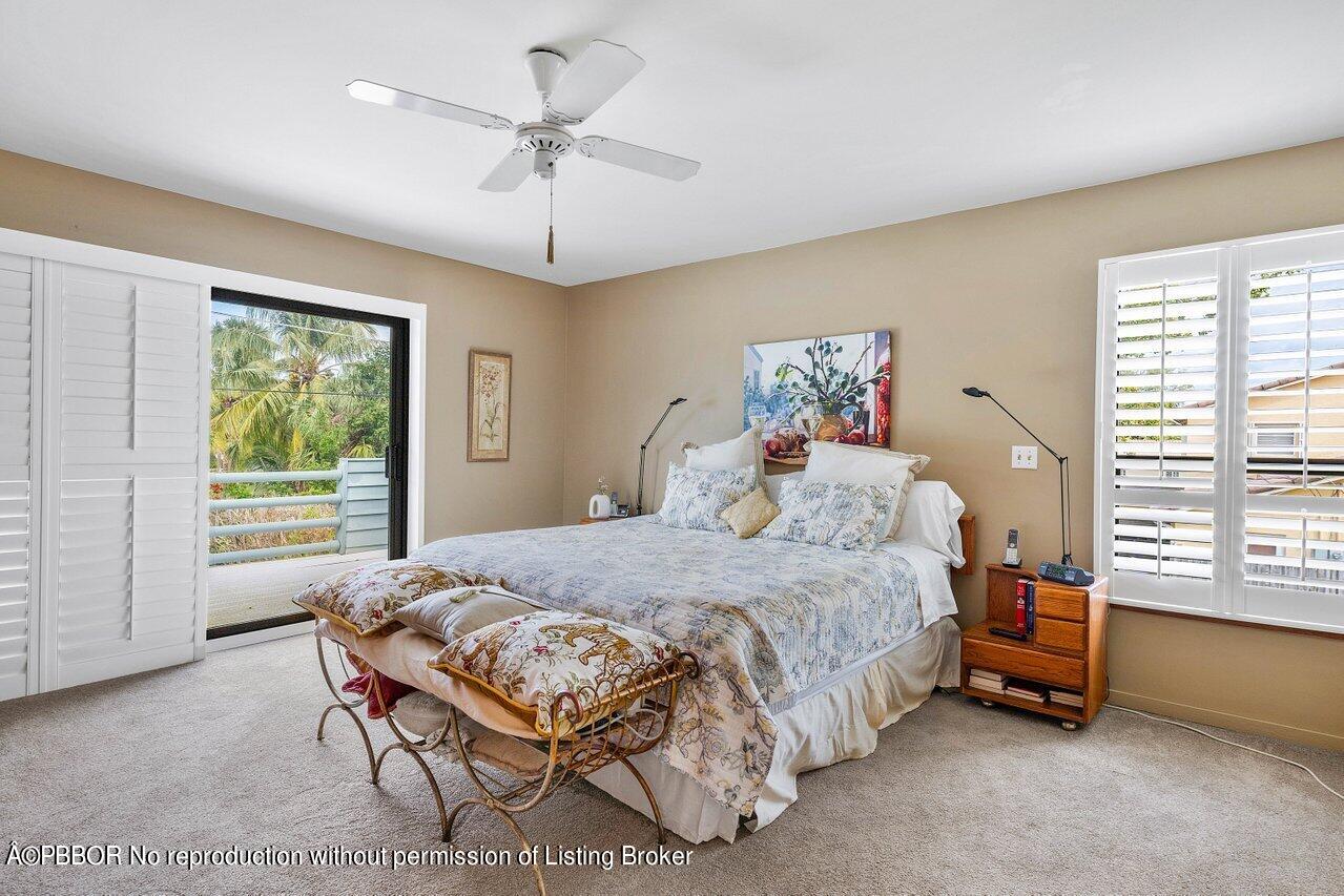 1111 Southwest 19th Street Boca Raton, FL 33486 - Photo 26 of 37 a bedroom with a bed and a window