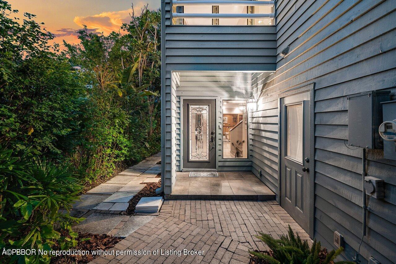 1111 Southwest 19th Street Boca Raton, FL 33486 - Photo 31 of 37 a view of a house with a small yard and wooden floor and fence