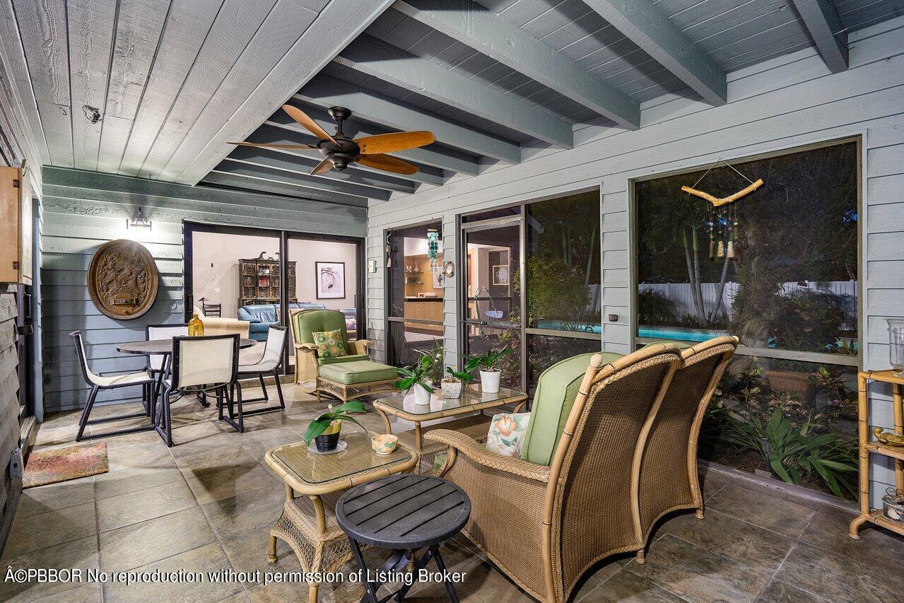 1111 Southwest 19th Street Boca Raton, FL 33486 - Photo 32 of 37 a outdoor living space with furniture and a fireplace