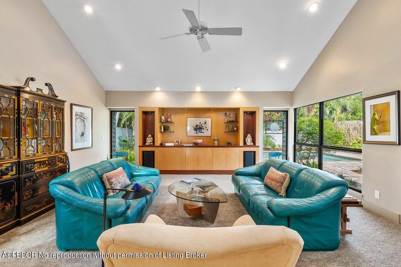 1111 Southwest 19th Street Boca Raton, FL 33486 - Photo 8 of 37 a living room with furniture and a flat screen tv