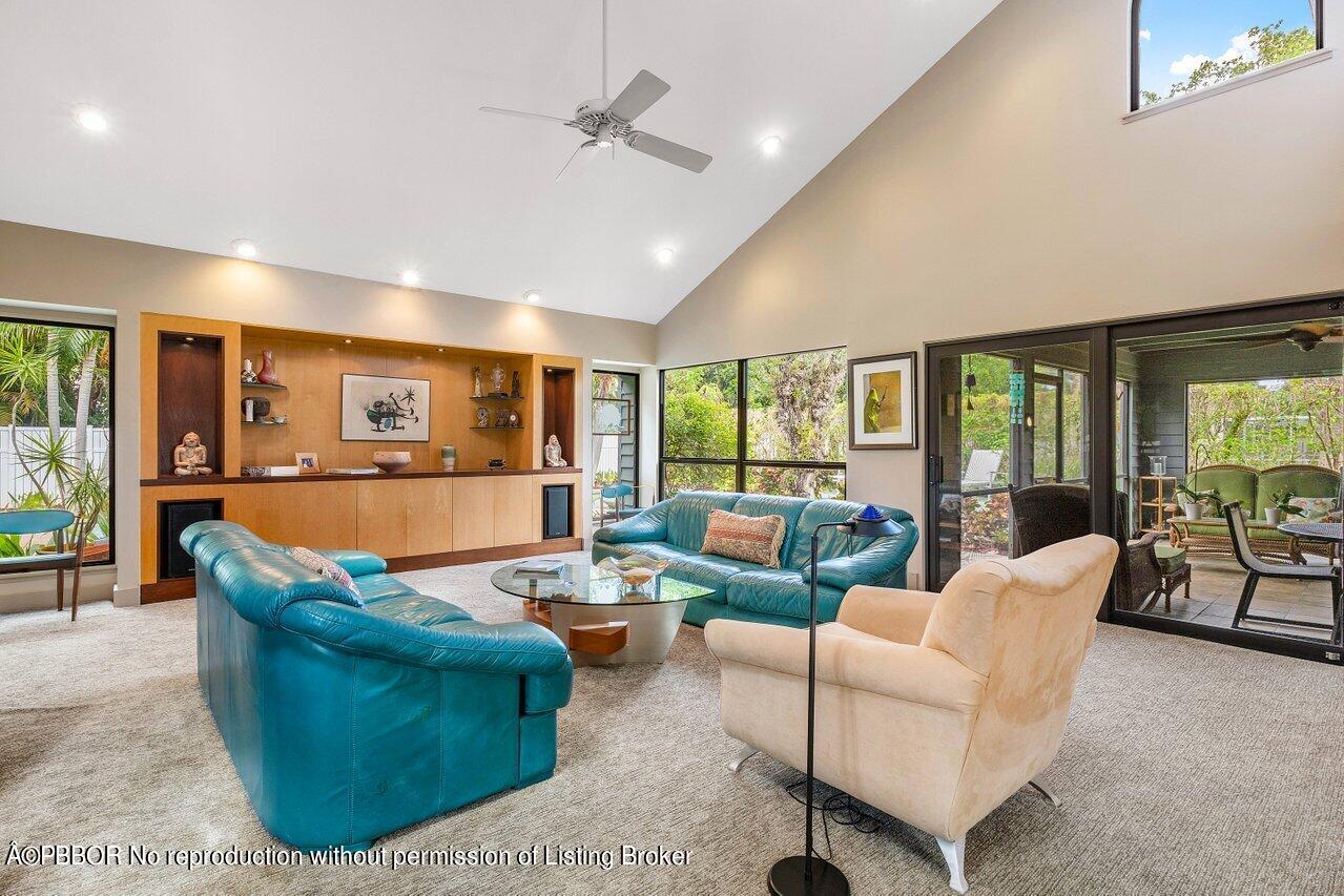1111 Southwest 19th Street Boca Raton, FL 33486 - Photo 9 of 37 a living room with furniture dining table and a large window