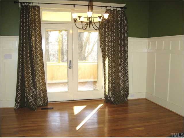 13024 Powell Road Wake Forest, NC 27587 - Photo 2 of 12 Lovely dining room with wainscot & access to screened porch