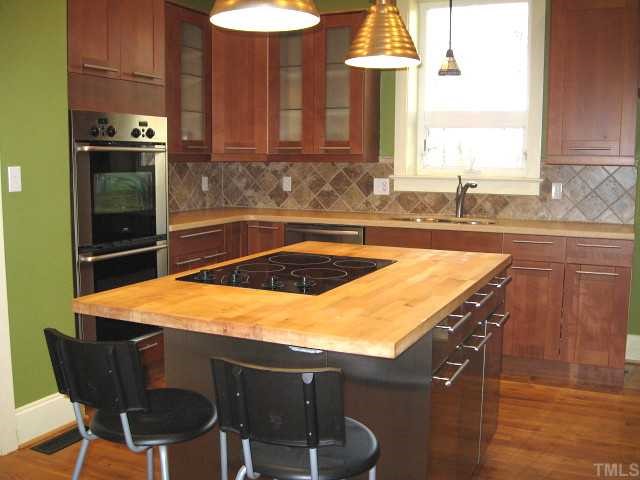 13024 Powell Road Wake Forest, NC 27587 - Photo 3 of 12 Updated kitchen with new cabinets, counters, backsplash, & stainless steel appliances/island