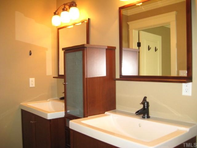 13024 Powell Road Wake Forest, NC 27587 - Photo 7 of 12 Private master bath with dual vanities, garden tub/shower, & ceramic tile floor