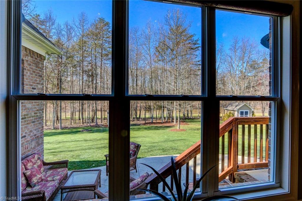 7085 Lanier Road Summerfield, NC 27358 - Photo 7 of 30 View of lake through the Great room windows