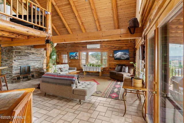 a roof deck with a table and chairs