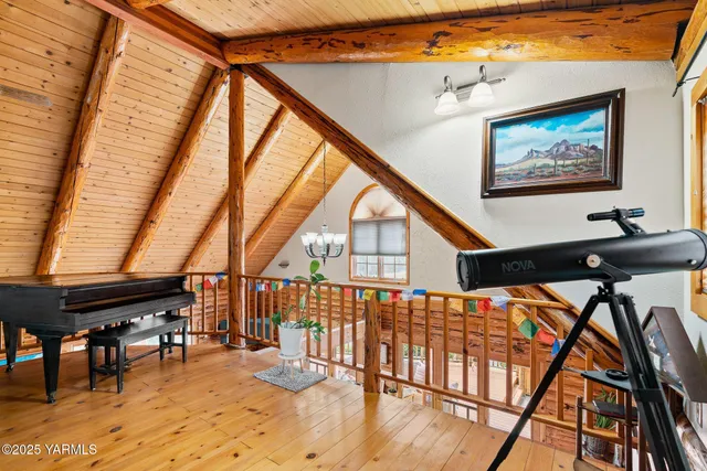 a bedroom with a bed a dresser and mirror