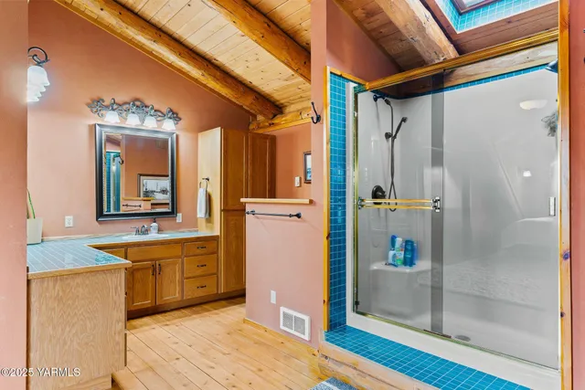 a living room with furniture a chandelier and a couch